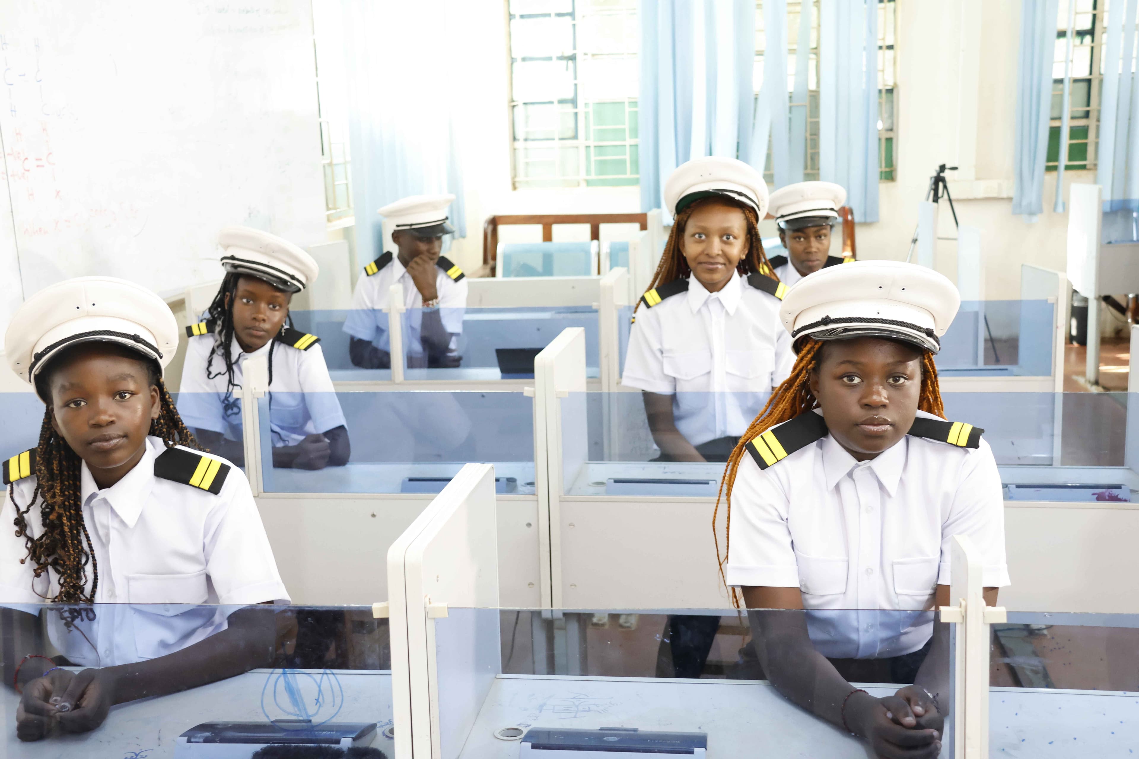 Pioneer students in maritime uniforms seated in a training classroom